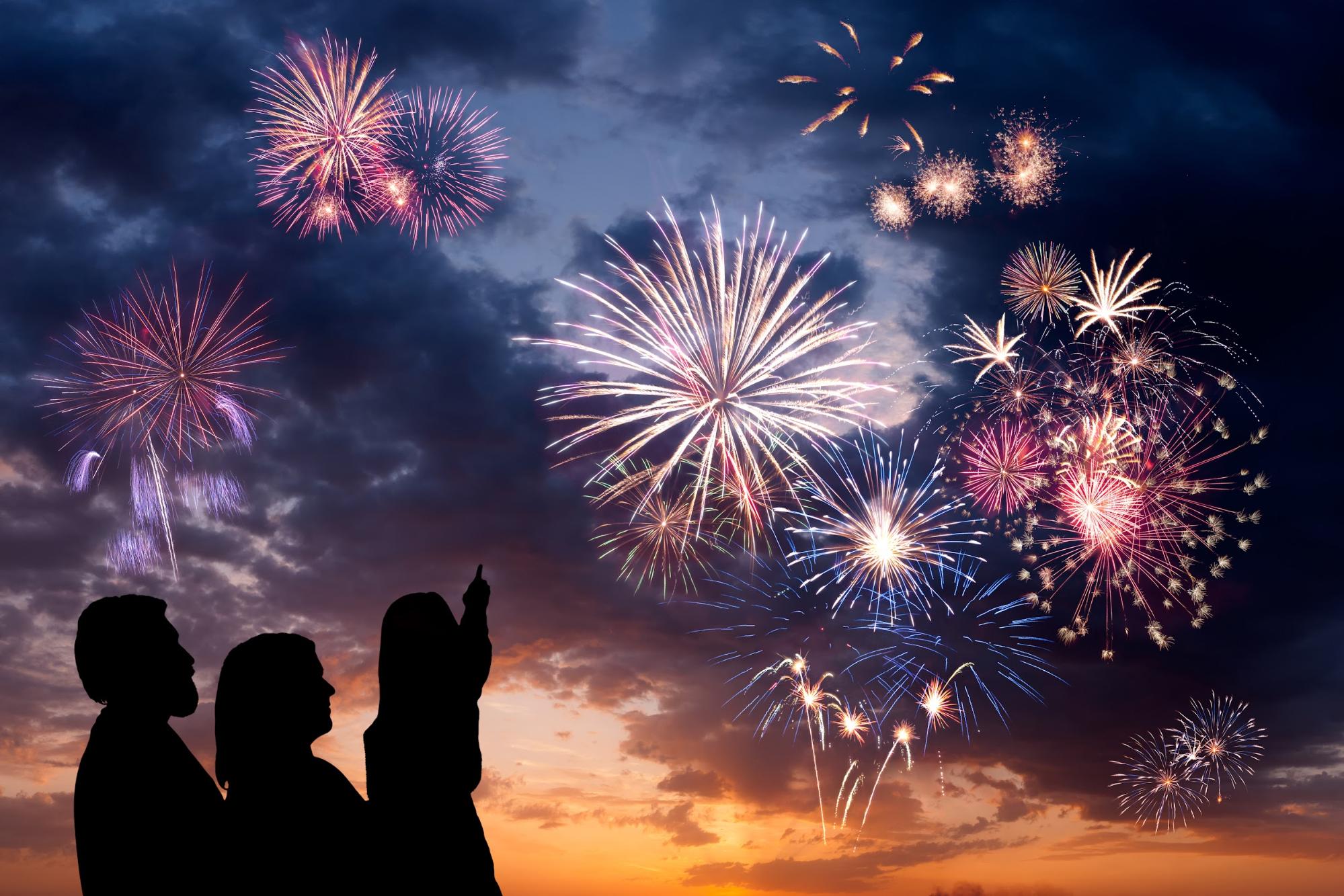 people looking at fireworks in the sky ©Dmytro Balkhovitin