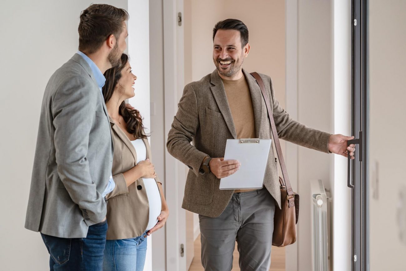 First time homebuyers touring a new construction home with a real estate agent in Metro Atlanta ©Lordn
