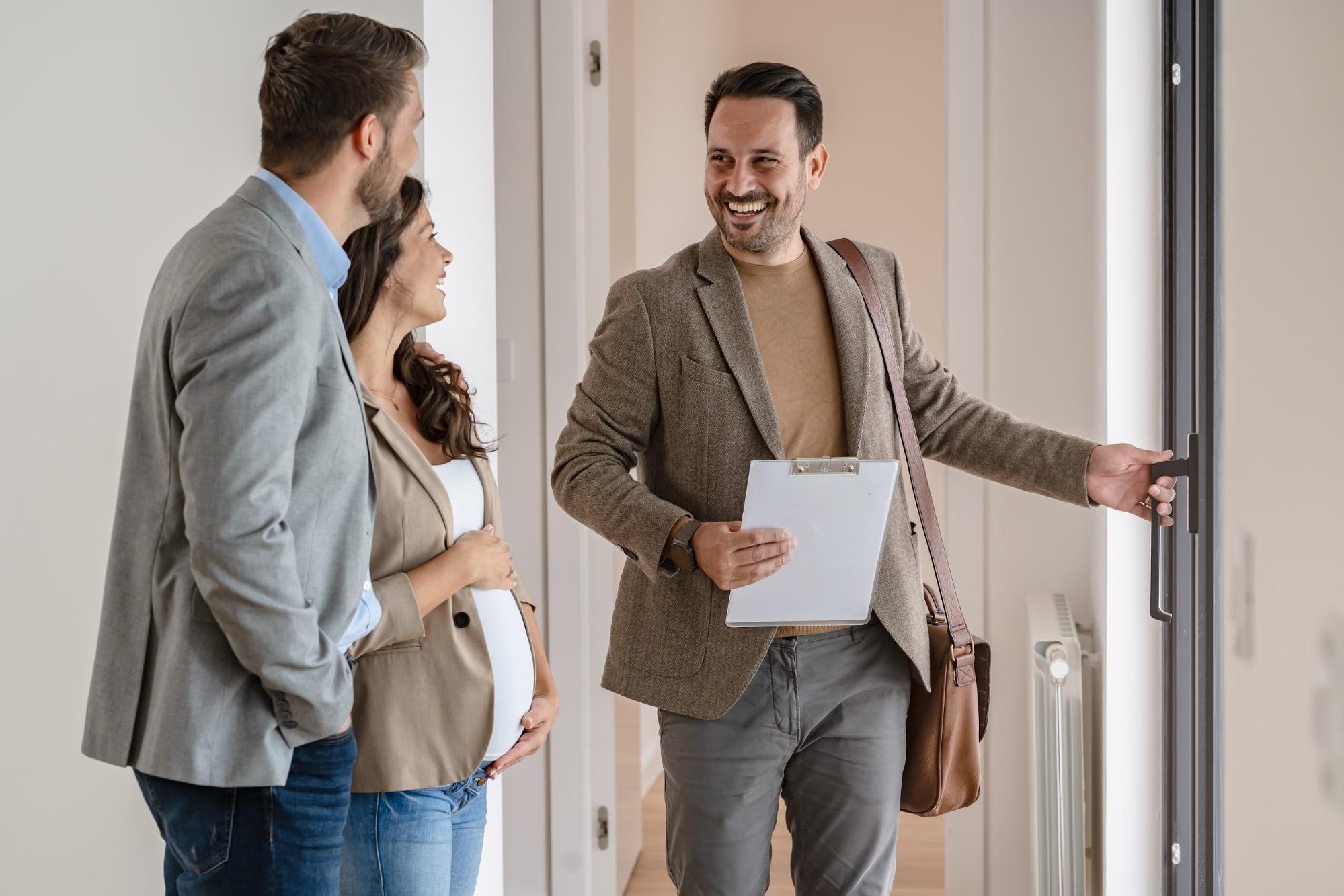First time homebuyers touring a new construction home with a real estate agent in Metro Atlanta ©Lordn
