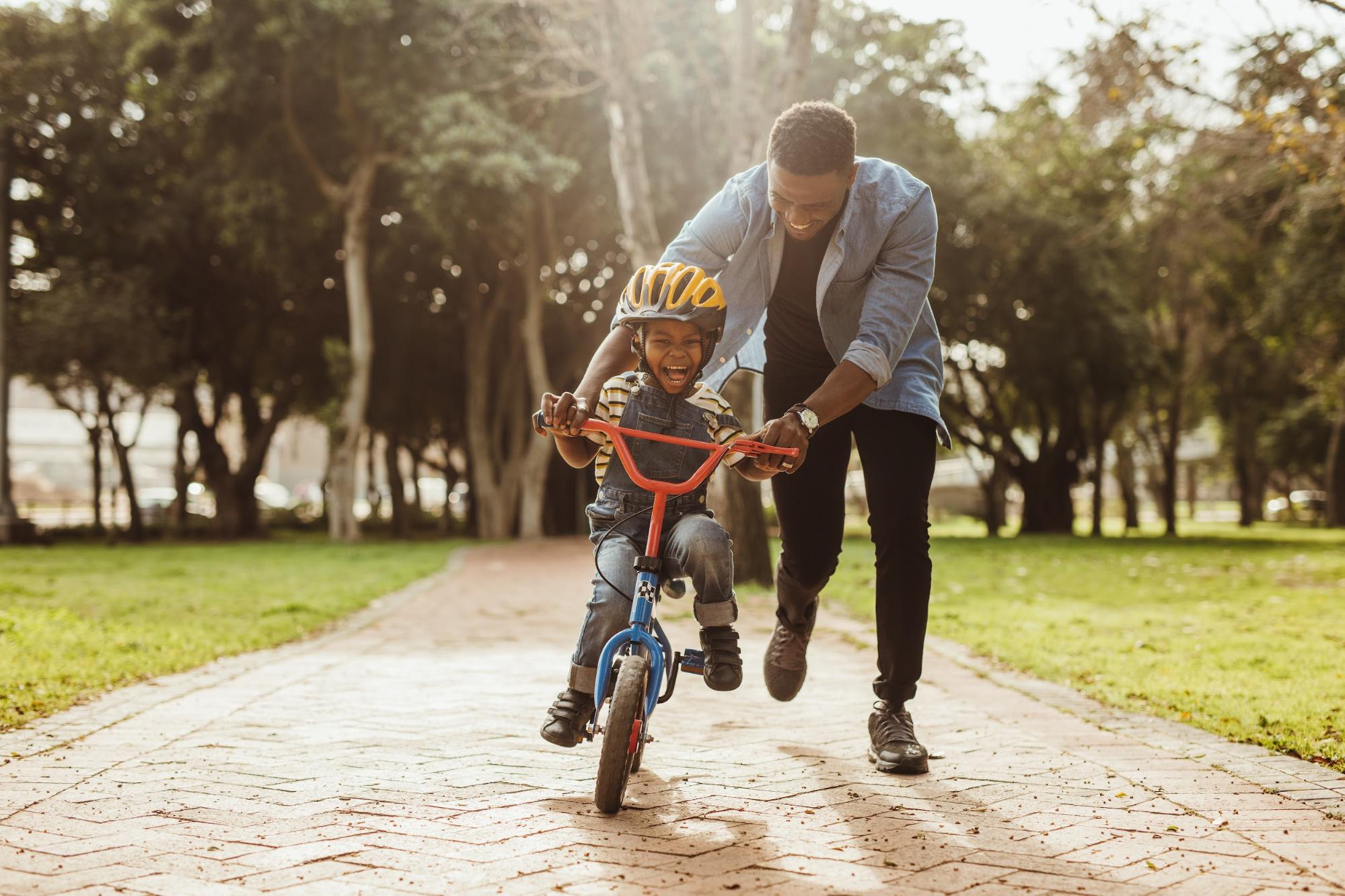 Child learning to bike in park near new townhomes in Union City, GA. ©Jacob Lund