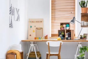 Bright and organized hobby room with desk, storage, and craft supplies
©Ground Picture
