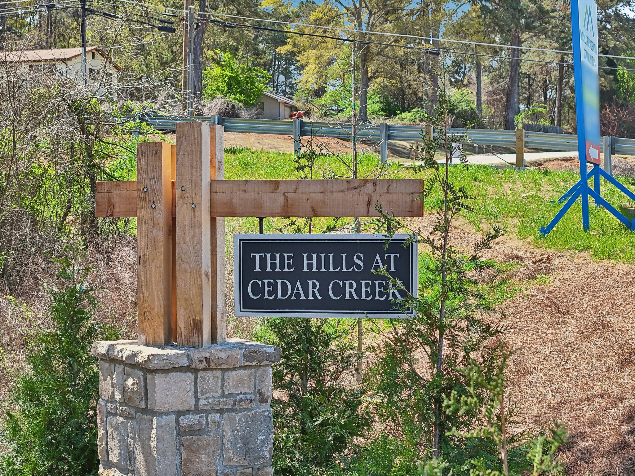 Entrance sign for The Hills at Cedar Creek, a community with move-in ready homes in Winder, GA