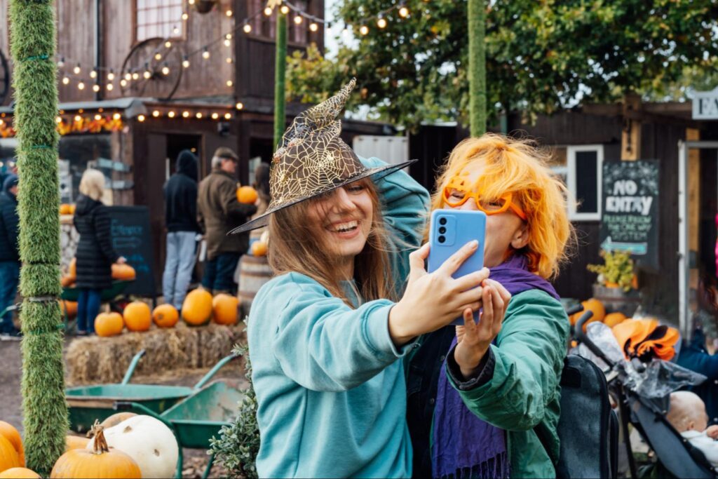 Two friends enjoying a local fall festival ©