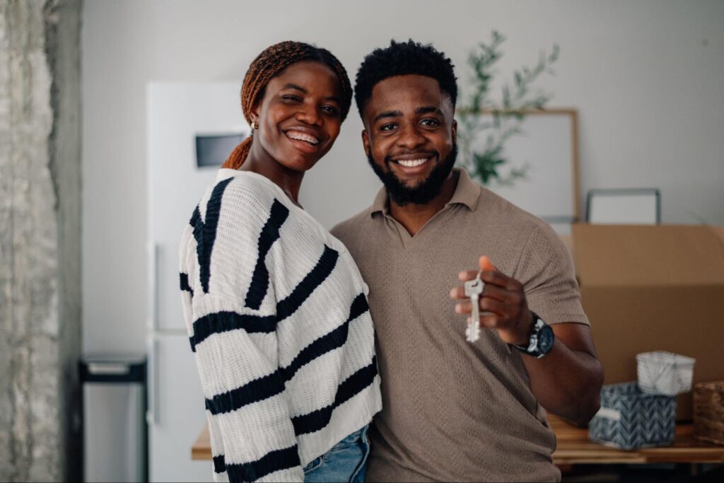 Young couple smiling and holding new house keys, celebrating homeownership
© zamrznutitonovi