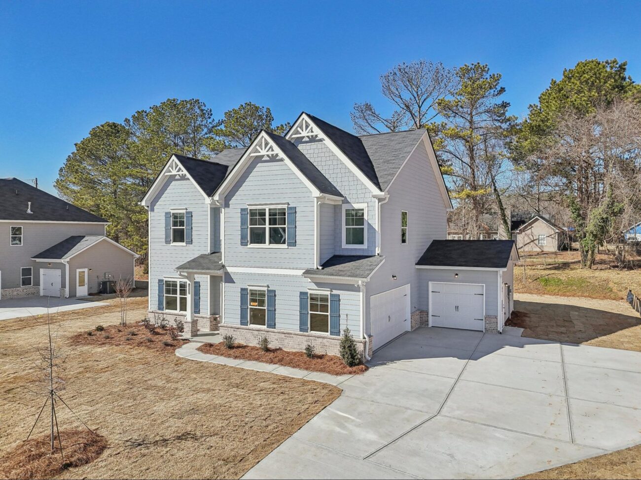 New construction Brentwood floor plan home exterior at Stephens Landing in Loganville, GA.