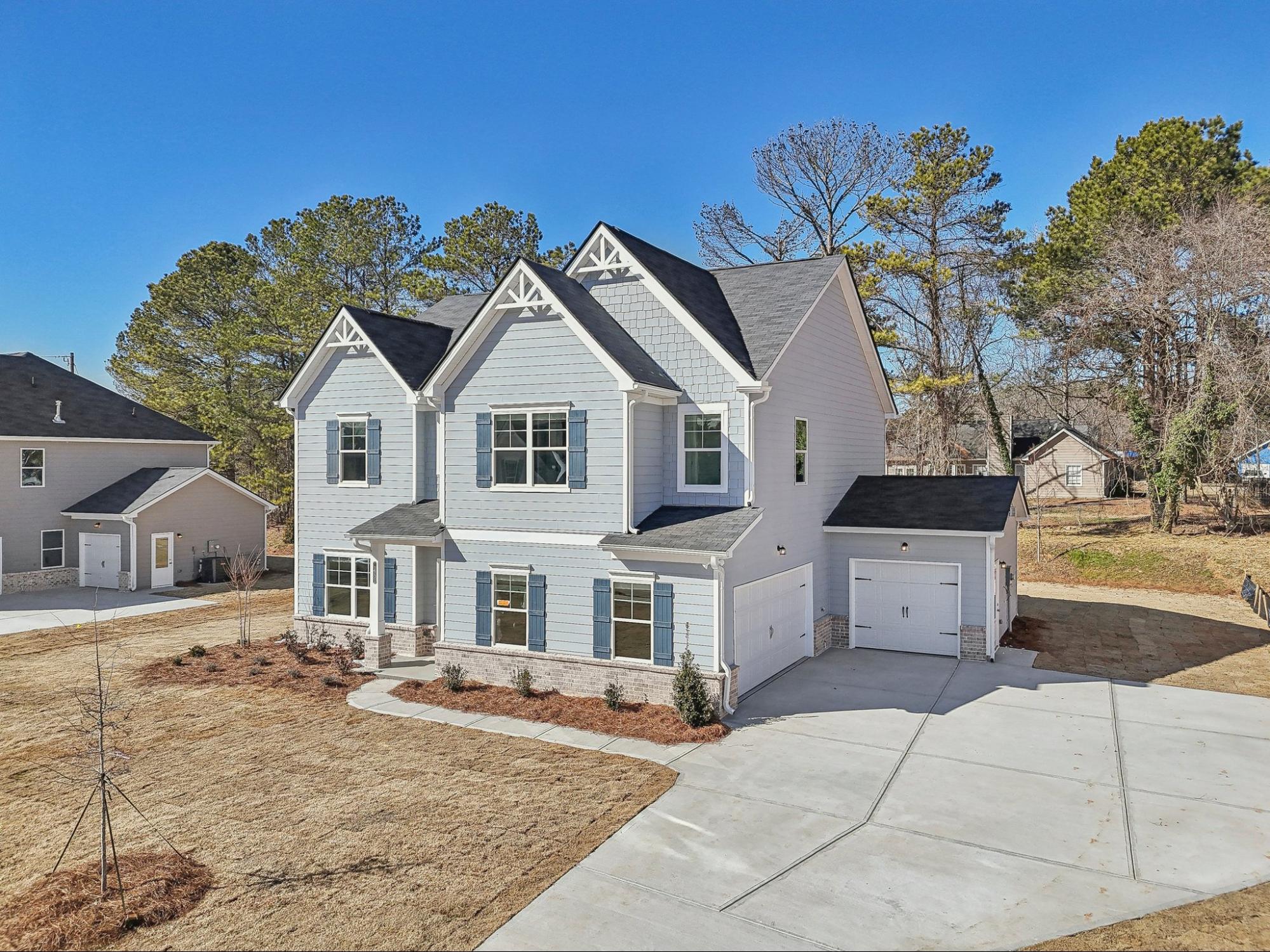 New construction Brentwood floor plan home exterior at Stephens Landing in Loganville, GA.