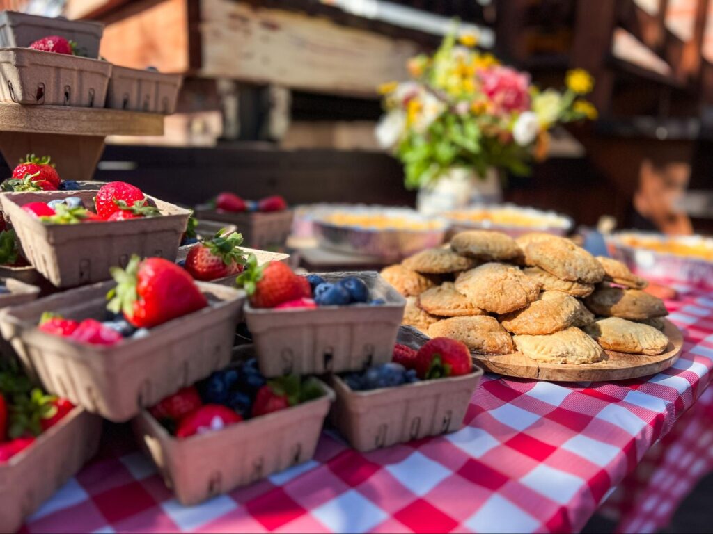 Fresh berries and baked pastries at a metro Atlanta neighborhood farmers market. ©coloradorandi