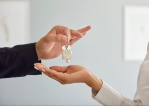 First time homebuyer receiving keys to a brand new DFW area townhome