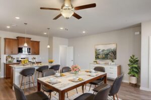 Modern townhome kitchen island and dining area layout at Solterra Texas