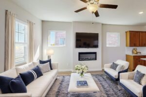 Open concept living room with a modern fireplace in a Mesquite TX townhome