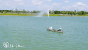two people fishing in a canoe
