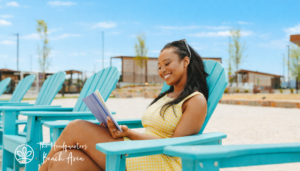young women reading on white sand beach